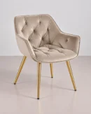 Silla tapizada de terciopelo con patas doradas
